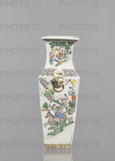Vase, Chinese, 18th century, painted colored porcelain, height 31.2 cm, width 11.0 cm; figurative genre scenes depicting battles., A tall, narrow porcelain vase with a tapered square shape is shown against a plain gray background, decorated with painted scenes of figures, trees, and landscapes in colors including green, blue, orange, yellow, red, brown, and black, and featuring a small sculpted lion head with a gold-colored ring on the front; the top rim and neck area show a painted tree scene, the main body displays several groups of people in traditional dress and horses amid foliage and hills, and the base has a band of vertical decorative stripes in muted colors.