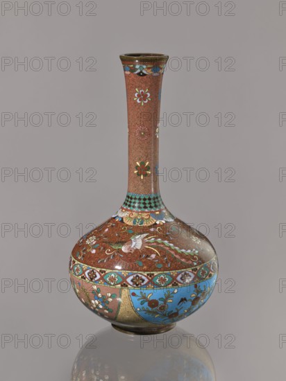 Vase, Japanese, ca. 1880 Meiji 13, Meiji period 1868–1912; cloisonné enamel kinseki; decorated with plants, butterflies, and phoenixes hoo; vessel; height 30.5 cm, diameter 16.0 cm., A tall, narrow-necked vase with a bulbous base featuring a glossy finish and a palette of brown, blue, green, white, red, gold, and black, decorated with floral motifs and a bird design on the rounded body, a patterned band around the widest part, a textured brown neck with scattered flower motifs, and a reflective surface showing a subtle reflection of the vase on a neutral gray background.