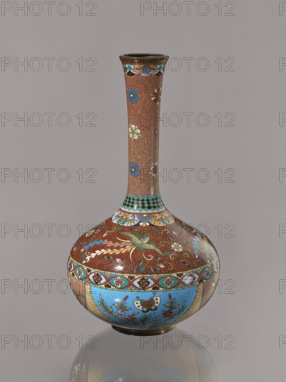 Vase, Japanese art, Japanese culture, plants, butterflies, phoenixes iconography, Meiji 1868–1912, hoo phoenix, cloisonné enamel, ca. 1880 Meiji 13, Japan, vessel, height 30.5 cm, diameter 16.0 cm, A decorative bulbous vase with a long narrow neck standing on a reflective surface, showing a smooth glossy finish and intricate painted patterns. The neck and upper body have a reddish-brown background with a fine swirling texture and scattered floral motifs in blue, white, green, and yellow. A band of repeating scallop or scale shapes in turquoise and black separates the neck from the rounded shoulder, which features ornate bird and botanical designs in green, gold, white, and blue on the reddish-brown ground. The lower body displays panels with bright sky-blue backgrounds containing floral sprays and a butterfly motif, bordered by geometric and floral bands in turquoise, red, white, and gold. The rim and base have darker bronze or brown tones, and overall the visible colors include reddis...