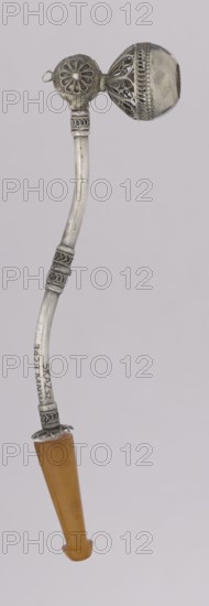 Pipe for smoking hashish, Islamic art, Arabic culture. The stem is slightly curved, thin, ending with a flattened amber, mouthpiece. The short silver pipe may have been used for smoking hashish — a hallucinogenic drug produced from cannabis flowers; a lump of the compressed substance was placed in the recess at the end of the pipe. The mouthpiece was made of amber, and the main part of the object was decorated using the filigree technique — ornaments from thin wires joined into intricate patterns. 1st half of the 20th century, Yemen; pipe; height 12.5 cm, width 1.7 cm., A slender curved object composed of a silver-colored metal shaft with ornate raised bands and filigreework near both ends, topped by a spherical decorative element with openwork patterns and a small circular disk with petallike cutouts beside it, and finished at the lower end with a tapered, smooth, amber-colored handle.