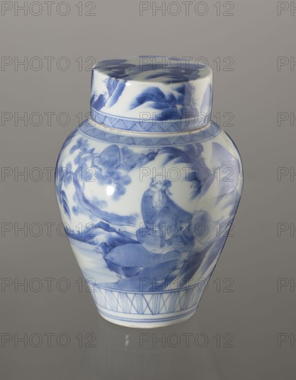 Storage vessel with lid by Zôshuntei Sanpo Zoshuntei Sampo, c. 1842–1878, Arita, Japan. Blue-and-white porcelain, pear-shaped vessel with flat cylindrical lid; height 21.8 cm, diameter 15.3 cm. Decorated in cobalt underglaze in several bright tones with a Chinese-style landscape: an old man resting under a pine on a rocky cliff overlooking water, mountains, a waterfall, and distant boat sails. Lower register has a wide ornamental band of three vertical and two crossed lines; neck and lower edge of lid feature diagonal-line bands forming triangular motifs; lid bears a rock motif. Decoration modeled on Chinese Southern School painting and Japanese bunjinga nanga influences; free-form painting and finely executed lines indicate a highly skilled decorator. Underglaze cobalt signature on base: Zoshuntei Sampo zo made by Zoshuntei Sampo. Genres/themes: pines, mountains, waterfalls, sages, kachôga; classification: storage pot; period: late Edo–Meiji Edo 1603–1868; Meiji 1868–1912., A ceramic ...