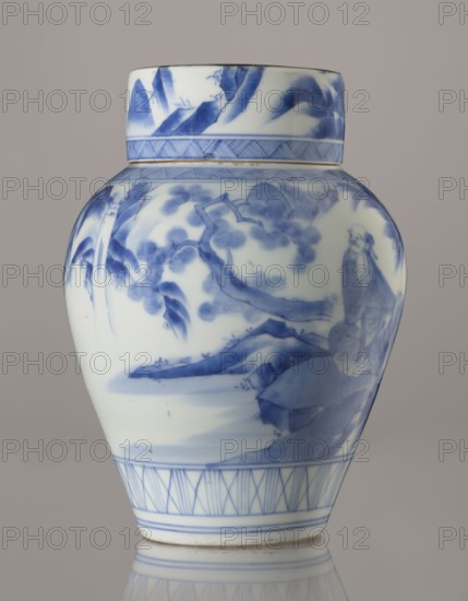 Storage vessel with lid by Zôshuntei Sanpo c. 1842–1878. Pear-shaped blue-and-white porcelain vessel with flat cylindrical lid; height 21.8 cm, diameter 15.3 cm; Arita, Japan. Decorated in a Chinese-style landscape: an old man resting under a pine on a rocky cliff overlooking a wide body of water, with mountains, a waterfall, lofty peaks, and distant boat sails. Lower base has a wide ornamental band of three vertical and two crossed lines; neck and lower edge of lid have diagonal-line bands forming triangular motifs; lid decorated with a rock motif. Decoration modeled on Chinese Southern School painting and the Japanese bunjinga nanga movement. Free-form painting with precise, masterful lines; cobalt in bright, pure tones. Underglaze cobalt signature on the base: Zoshuntei Sampo zo made by Zoshuntei Sampo. Edo–Meiji period late 19th century., A ceramic jar with a rounded body and a short neck resting on a reflective surface, decorated in blue on a white ground; the painted design shows...