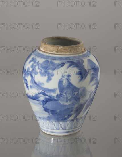 Storage Vessel with Lid, Zôshuntei Sanpo 1841–1878. Storage pot, blue-and-white porcelain, Japanese, c. 1842–1878, Arita, Japan. Pear-shaped vessel with flat cylindrical lid. Decorated in a Chinese-style landscape: an old man resting under a pine on a rocky cliff overlooking a broad body of water, with mountainous scenery, a waterfall, lofty peaks, and distant boat sails; lower base has a wide ornamental band of three vertical and two crossed lines; neck and lower edge of lid have diagonal-line bands forming triangular motifs; lid decorated with a rock motif. Decoration modeled on Chinese Southern School painting and Japanese bunjinga nanga influence; free-form painting with precise, masterful lines; cobalt in bright, pure shades in several tones. Underglaze cobalt signature on bottom: Zoshuntei Sampo zo made by Zoshuntei Sampo. Height 21.8 cm; diameter 15.3 cm., A ceramic jar with a rounded body and a narrow rim, decorated in blue on a white ground; the top rim has an unglazed band in...