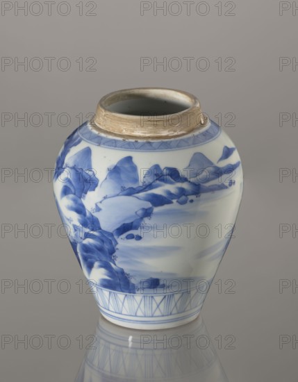 Storage vessel with lid by Zôshuntei Sanpo Zoshuntei Sampo zo, c. 1842–1878. Pear-shaped blue-and-white porcelain vessel with flat cylindrical lid, Arita, Japan. Decorated in cobalt underglaze in several tones with a Chinese-style landscape: an old man resting alone under a pine on a rocky cliff overlooking a wide body of water, with mountainous scenery, a waterfall, lofty peaks, and boat sails on the horizon. Lower base bears a wide ornamental band of three vertical and two crossed lines; neck and lower edge of lid feature diagonal-line bands forming triangular motifs; lid is decorated with a rock motif. Decoration modeled on Southern School Chinese painting and the Japanese bunjinga nanga movement; free-form painting and precise, masterful lines. Height 21.8 cm; diameter 15.3 cm., A porcelain jar with a rounded body and a slightly flared, unglazed rim sits against a neutral gray background, decorated with blue painted landscape motifs showing stylized rocky forms and flowing water, w...