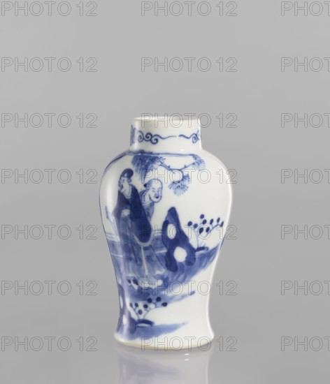 Meiping vase, meiping vessel type, ceramics, blue-and-white porcelain, figural scenes, Qing style, Chinese art, Chinese culture, park scenes, landscape motifs, Qing 1644–1911, baluster-shaped with a belly narrowing at the bottom and flaring towards the foot, narrow neck, 19th century, China, vessel, height 12.5 cm, diameter 7.8 cm, A small ceramic vase with a rounded shoulder and slightly flared base sits against a plain light gray background; the vase is white with blue painted decoration showing a scene of two figures standing near stylized rocks, foliage, and a tree branch, with additional decorative blue motifs around the neck and base; visible colors include white and several shades of blue, and the surface has a glossy finish that produces subtle reflections.