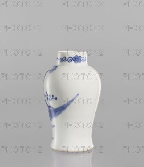 Meiping vase, meiping vessel type, ceramics, blue and white porcelain, figural scenes, Qing style, Chinese art, park scenes, landscape motifs, Qing 1644–1911, baluster-shaped with a belly narrowing at the bottom and flaring towards the foot, narrow neck, 19th century, China, vessel, height 12.5 cm, diameter 7.8 cm, A small white ceramic vase with a rounded body and a short neck sits against a plain gray background, decorated with a few blue painted motifs including a floral or botanical element and a scrolling band around the neck, and the surface shows a few tiny dark spots and subtle glossy reflections.