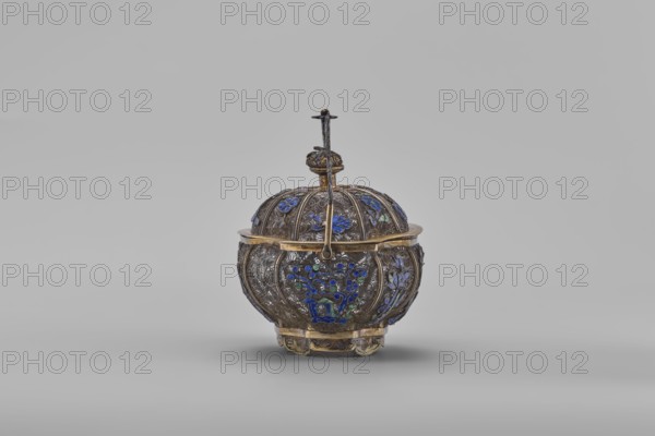 Basket with a lid; maker, Chinese; 19th century; Canton, China; container; decorated with flowers and ornaments; height 9.8 cm, width 10.5 cm, depth 7.5 cm., An ornate round container with a domed lid and a handle, primarily metallic in color with gold-toned accents and intricate engraved patterns, decorated with a few blue and green floral enamel motifs, resting on a short decorative base against a plain light gray background.