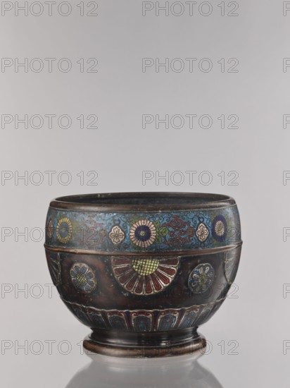 Flowerpot, champlevé enamel on bronze, floral ornament, jardinière, late 19th century Meiji period, 1868–1912, Japan; height 30.4 cm, diameter 41.2 cm;, A rounded decorative bowl with a dark brown base color featuring a band near the rim decorated with floral motifs in blue, green, yellow, pink, red, and white; the body shows several floral medallions in red, yellow, blue, green, and white with metallic outlines, and a lower frieze with repeated arch-like patterns in blue, red, and green; the interior rim appears dark, and the piece sits on a short rounded foot with brown and darker brown tones.