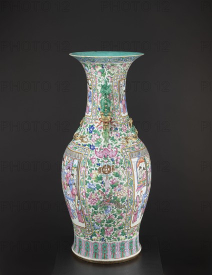 Vase, lion iconography, protection, court scenes, ceramics, Qing style, colored porcelain, Chinese art, Chinese culture, decorative vessel, Qing 1644–1911, rim covered with turquoise paint on the inside, 19th century Qing dynasty, China, vessel, height 90 cm, diameter 37.5 cm, A tall porcelain vase photographed against a dark background, showing a flared rim, a narrow neck, a bulbous body, and a slightly flared foot. The surface is covered in dense painted decoration with floral motifs and framed pictorial panels, featuring colors including green, pink, blue, turquoise, gold, white, and touches of purple and brown. There are ornate applied elements in a gold tone near the shoulder, and the painted designs include stylized flowers, leaves, and birds, along with human figures within rectangular panels. The rim interior appears turquoise, and the foot border shows a repeating decorative band in green and pink. The overall appearance is glossy and richly detailed.