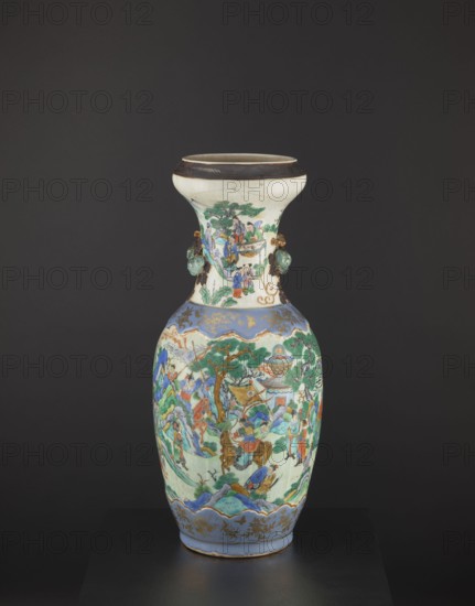 Vase, creator unknown, figurative scenes, Chinese art, colored porcelain, warriors, plant ornaments, ceramics, decorative vessel, pumpkins, knightly scenes, provenance unknown, Qing dynasty 1644–1911, Tongzhi reign 1862–1874, foot and arms decorated with applied plastic decorations, second half of the 19th century, China, vessel, height 62.5 cm, diameter 26.5 cm, A tall ceramic vase with a flared rim and a bulbous body sits against a dark background; the rim area is off-white with a dark brown band at the top, and the neck and body are decorated with painted scenes in a palette of green, blue, turquoise, red, orange, brown, and gold accents; the neck features a scene with several small human figures and green foliage and has a pair of small sculpted greenish handles on opposite sides; the main body shows a continuous painted landscape with trees, hills, buildings, and a group of figures in colorful robes, including a figure on horseback, all rendered with blue borders and gold ornament...