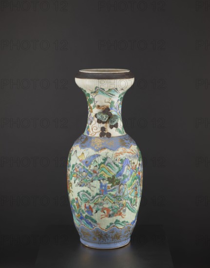 Vase, figurative scenes, Chinese art, Chinese culture, colored porcelain, warriors, plant ornaments, ceramics, decorative vessel, pumpkins, knightly scenes, Qing dynasty 1644–1911, Tongzhi period 1862–1874, foot and arms decorated with applied/relief decorations, 2nd half of the 19th century, China, vessel, height 62.5 cm, diameter 26.5 cm, A tall ceramic vase sits against a dark gray background, displaying a narrow neck that flares at the rim and a rounded body. The vase features a pale cream base with colorful painted scenes and raised decorative elements; visible colors include blue, green, turquoise, orange, red, brown, gold, and black. The neck area has a band of dark brown near the rim and painted green and blue landscape motifs with small raised, textured brown and green adornments. The main body shows a detailed continuous scene with stylized green and turquoise mountains, blue and purple highlights, and figures and animals rendered in shades of red, orange, blue, and green. Go...