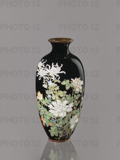 Vase, chrysanthemums, roses; Japanese art; Japanese; flowers; Meiji 1868–1912, ca. 1900; Japan, Nagoya; vessel; height 24.4 cm; diameter 11.7 cm, A glossy black vase with a flared rim and narrow neck sits against a neutral gray background, decorated with a group of intricately painted flowers and foliage in shades of white, pale green, light yellow, soft pink, muted blue, and touches of orange, with leafy stems and floral clusters wrapping around the body and a subtle reflection of the vase visible below.