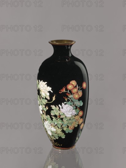 Vase, gift, chrysanthemums, roses, Japanese art, Japanese, flowers, Meiji 1868–1912, ca. 1900, Japan, Nagoya; vessel; height 24.4 cm, diameter 11.7 cm, A tall, glossy black vase with a narrow neck and flared rim, showing a painted floral design featuring a group of pale white and light pink flowers, clusters of small orange-red blossoms, and surrounding green leaves, with touches of gold on the rim and base; the vase sits against a plain gray background and casts a faint reflection on the surface below.