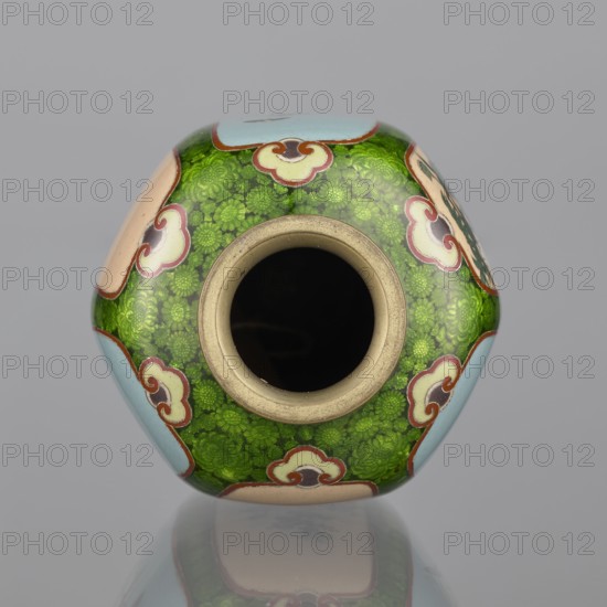 Vase, cloisonné enamel, floral pattern with butterflies and dense green floral rosettes in reserves; Japanese, Meiji period 1868–1912, 19th/20th century; vessel; height 15.3 cm, width 8.7 cm, depth 8.2 cm., A rounded vessel photographed from above showing its circular opening and a patterned exterior, with a central dark interior, a beige rim, a background of bright green floral motifs, pale blue and peach cartouche-like shapes outlined in red, and small accents of brown and white, set against a neutral gray background with a faint reflection beneath.
