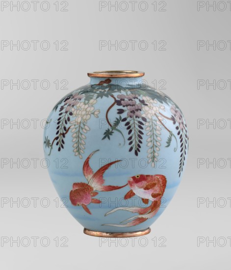 Vase, Gonda Hirosuke 1865-1937 author. Japanese, Meiji 1868-1912. Small spherical cloisonné enamel vase, one of a pair, on a low ring foot and a round ring spout, both elements set in silver-plated metal. Decorated with a realistically depicted, colorful motif of red veil fish with wisteria leaves and flowers hanging above on a light blue background. The bottom bears a maker’s mark in the form of a flaming pearl with the character ko in katakana — the mark of enameller Gonda Hirosuke of Nagoya. Circa 1890–1910. Nagoya, Japan. Vessel; height 9.0 cm, diameter 8.2 cm., A rounded ceramic vase with a narrow neck and rim finished in metallic copper, decorated on a pale blue background with a hanging floral motif in shades of purple, white, green, and dark blue, and showing a pair of swimming fish rendered in shades of red, pink, orange, and white with delicate fin details; the vase sits against a light gray backdrop.