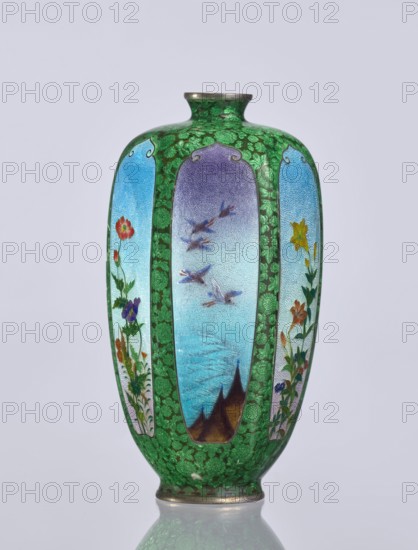 Vase, gift, repossession Krakow — Elongated hexagonal vase with a narrow spout. Cloisonné enamel decoration: small, densely spaced floral rosettes and butterflies on a black background; motifs include flowers, irises, birds, and butterflies. Japanese, Meiji period 1868–1912, 19th/20th century. Vessel. Height 12.5 cm; width 6.7 cm; depth 6.1 cm.