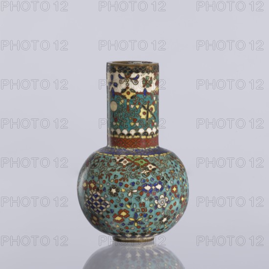 Vase, gift, Japanese, Meiji 1868–1912. Cloisonné enamel vase with a spherical belly and long cylindrical neck decorated over the entire surface with small floral and geometric motifs on a turquoise background. Circa 1880 Meiji Period, Nagoya, Japan. Vessel; height 9 cm, diameter 5.7 cm., A small rounded vase with a tall narrow neck decorated in intricate floral and geometric patterns, showing colors including turquoise, blue, red, green, white, yellow, and gold on a pale gray background.
