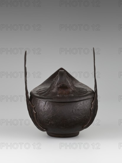 Duck incense burner, Chinese, Qing dynasty 1644–1911, 19th century; earthenware vessel in the form of a duck with wings; incense burner; height 9.7 cm, width 13.6 cm; subject: ducks/birds., A dark brown rounded vessel with a lid is shown against a neutral gray background; the vessel has a textured surface and a short foot at its base, a pointed, sculpted top on the lid, and two tall, thin vertical handles rising from opposite sides that curve slightly inward, with decorative flared edges where they meet the body.