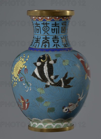 Vase, Chinese, Qing dynasty 1644–1911, 19th century. Cloisonné enamel on vessel: vase on a foot with a neck. Decoration: fish and crabs on a turquoise background, archaizing inscription on the neck. Height 23.2 cm; diameter 9.1 cm., A rounded vase with a flared rim, decorated in cloisonné with a bright blue background and a gold rim and base; the main body shows a group of stylized fish and aquatic creatures in black, red, white, gold, and yellow, swimming among swirling wave patterns and green lotus leaves, with fine gold outlining and accents and a decorative band of blue and green patterns at the shoulder and foot.