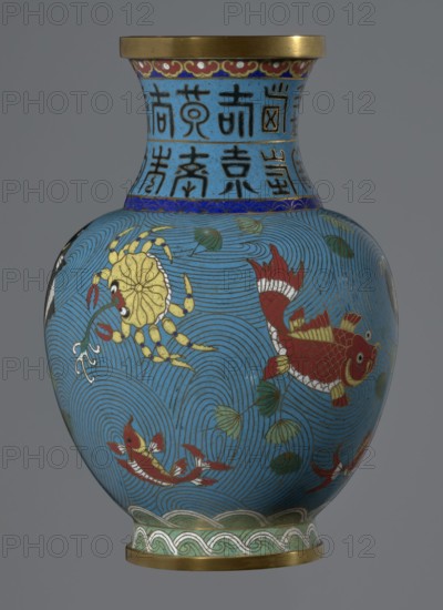 Vase, 19th century, China. Cloisonné enamel vase on a foot with a neck; height 23.5 cm, diameter 9.3 cm. Decoration: fish and crabs on a turquoise background, archaizing inscription on the neck. Qing dynasty style; Chinese art., A rounded vase with a flared neck and a metallic rim sits against a plain gray background; the vase surface is predominantly blue with swirling wave-like line patterns, decorated with red fish with white and yellow details, a yellow crab-like creature, several green leaves, and bands of decorative motifs in blue, green, red, gold, white, and black around the neck and base.