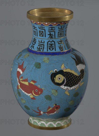 Vase, Chinese, Qing dynasty 1644–1911, 19th century. Cloisonné enamel; vessel on a foot with a neck; height 23.5 cm, diameter 9.3 cm. Decoration: fish and crabs on a turquoise background, archaizing inscription on the neck., A rounded vase with a flared neck and a metallic rim, predominantly turquoise blue in color with swirling wave patterns covering its body; decorative fish motifs in red, black, gold, white, and yellow appear swimming among green leaf-like shapes; the neck area shows a band of blue with darker characters or symbols rendered in black and accented with gold, and a narrow darker blue band separates the neck from the body; the base has a decorative border in pale green, white, and gold and a metallic foot ring.