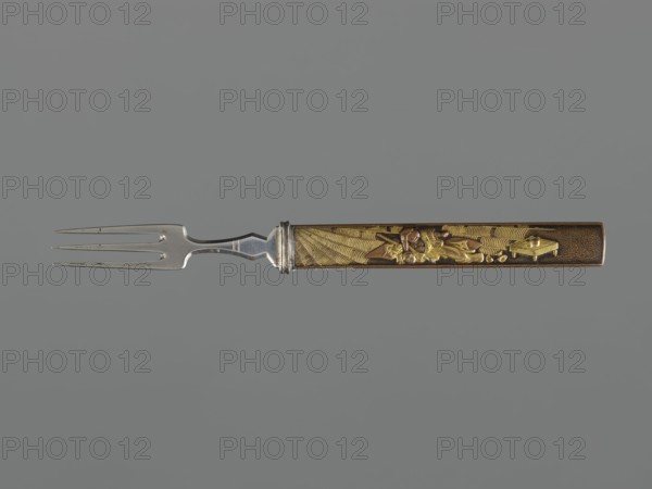 Fork with knife handle kozuka, Japanese, Edo period 1603–1868, 18th century; materials/objects related to swords/katana handles kozuka, forks; cutlery; height 16.9 cm, width 1.4 cm., A three-pronged metal fork with a silver-toned shaft and decorative collar is attached to a long rectangular handle that features raised ornamental elements in gold and bronze tones against a darker brown background; the handle shows a textured pattern and sculpted figures or shapes in metallic gold, and the overall image background is a muted gray.