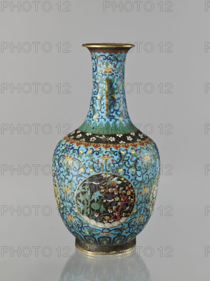 Vase, 19th century, Qing dynasty China. Cloisonné enamel vessel with a neck, height 33.0 cm, diameter 15.0 cm, weight 1.7 kg. Decoration: floral and plant tendrils on a turquoise background; birds and animals cranes, deer, tigers and zoomorphic motifs in circular medallions on a plant background; peonies, lotuses, chrysanthemums, lotus tendril and meander ornaments. Two stylized handles on the sides of the neck., A tall, narrow-necked vase with a rounded body decorated in intricate cloisonné patterns, predominantly turquoise and blue with accents of gold, black, red, green, and white; the neck features scrolling blue and gold floral motifs on a turquoise background with a gold rim, and a thin gold handle-like strip running down from the shoulder; the bulbous body is covered in swirling floral and vine designs in blue and turquoise with gold highlights and several circular panels set against black backgrounds containing stylized botanical and wave motifs in red, green, white, and gold; ...