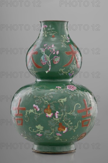 Vase, Paderewski, Ignacy Jan 1860-1941, Chinese art, Chinese culture, Qing 1644–1911 style; calabash form decorated with flowers, butterflies, fruit peaches, lingzhi, peonies, and floral ornament on a green background with pictographic signs among the plant motifs; 18th century, China; vessel; height 34.3 cm, diameter 24.0 cm, A double-gourd shaped ceramic vase with a glossy green surface decorated with painted floral vines and blossoms in pink, light green, blue, and gold, and with several large stylized motifs in a reddish-orange color, set against a neutral gray background.