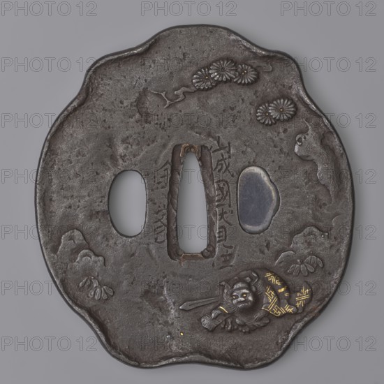 Crossguard tsuba, Kaneie role classification of creator, school craftsman author; tsuba in the shape of a kobushi gata with a slightly convex edge; kôgai hitsu closed with shakudô. Decorated on both sides in low and high relief with details inlaid with gold and shakudô. Obverse: Shôki the demon slayer crouched under a tree; Reverse: sketched landscape motif with pine trees and rocks. Materials/styles: shakudô, gold inlay; subject: demons, Shôki, landscape. 18th century Edo period, 1603–1868. Japan — Yamashiro province, Fushimi city. tsuba. Height 8.9 cm; width 9.6 cm; depth 0.65 cm. Maker: Kaneie., A dark metallic round object with an irregular scalloped edge resting against a neutral gray background, showing a textured, pitted surface in shades of dark gray and black. The object has three irregular openings near its center and a small smooth inset area with a slightly lighter gray tone. There are several raised floral motifs near the upper edge in dark gray with small bright golden do...