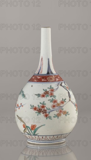 Bottle, Edo period 1603–1868, early 18th century, Japan. Porcelain sake bottle vessel, height 22.1 cm, diameter 12 cm. Decorated in the kakiemon style with a motif of the three friends of winter bamboo, plum, and pine; rock, and two borders with plant motifs and floral patterns on the neck. Materials: ceramics porcelain., A pale ceramic bottle with a long narrow neck and bulbous body sits against a neutral gray background; the surface is primarily white with painted floral motifs in red, green, blue, and touches of yellow, showing branches with clusters of red-orange blossoms and green leaves, a band of red with floral ornamentation near the shoulder, blue linear accents around the base and neck, and a small area of brownish discoloration near the top rim.