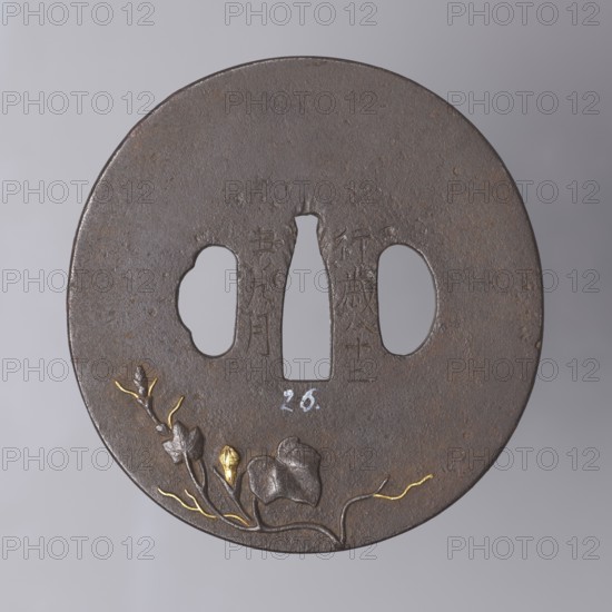 Crossguard tsuba, Masayoshi. Round tsuba maru gata with a rectangular edge kaku mimi, decorated on both sides with an asymmetrically composed high relief—carved takabori and inlaid with copper and gold takazôgan—motif of a plump pumpkin fruit with decoratively twisting stems with leaves and flowers. Details made with gold inlay using the nunome technique. Signed. 1st half of the 19th century Edo period, 1603–1868. Japan; Inaba historical province. Tsuba. Height 8.0 cm, width 8.35 cm, depth 0.45 cm., A round dark brown metal disk with a slightly rough textured surface and a few areas of rust-toned brown, featuring three cutouts near the center including a narrow vertical shape and two rounded shapes, and a decorative relief of a flowering plant along the lower edge with a few gold-colored highlights on the buds and slender stems and leaves in darker brown tones against a neutral gray background.