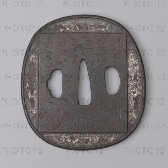 Crossguard tsuba, Tsuchiya Yasuchika 1670–1744, Nara school. Tsuba in the nadegaku gata rectangle with rounded sides form with a slightly distinct rounded edge uchi kaeshi. Obverse in low relief: an elephant covering almost the entire plate; on its back a saddle cloth decorated with a rosette with a tendril and bordered with a meander, supporting a Buddhist flaming jewel Cintamani, symbolizing liberation through the Buddha. Reverse: a large rectangular panel with an inscription in kanji — a fragment of the Lotus Sutra; the backside bears a lengthy inscription relating to the arrival of the elephant in Japan. Edo period 18th/19th century, Japan. Metal tsuba; height 8.7 cm, width 7.9 cm, depth 0.4 cm., A flat, rounded object with a square central panel and three irregularly shaped cutouts, made of dark brown metal with areas of lighter metallic wear; the surface shows a textured, slightly pitted appearance and faint incised lines; a ring of darker brown outlines the outer edge while seve...