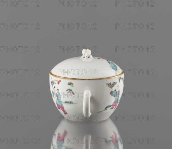 Teapot with a lid, Chinese porcelain teapot decorated with overglaze enamels and iron red; Qing dynasty, Tongzhi period 1862–1874. Subject: gardens and genre scenes. Material: colored porcelain; fragment. Function: vessel teapot. Dimensions: height 10 cm, width 15.2 cm, depth 10.7 cm; weight 0.3 kg., A white porcelain lidded cup with a rounded shape and a single handle sits centered against a gray background, the lid topped with a small white sculpted finial; the cup has painted scenes in turquoise, pink, green, and red hues and small floral or leaf motifs, with a thin gold rim near the top; the bottom of the cup and its painted figures are softly reflected on the shiny surface beneath, and the overall visible colors include white, gray, turquoise, pink, green, red, and gold.
