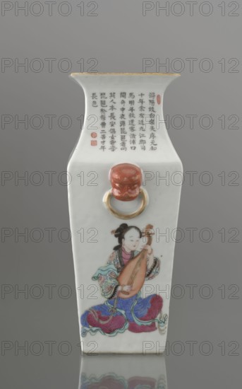 Vase with two handles, Chinese art, Chinese culture, Qing 1644–1911, Qing style, ceramics, inscriptions, lion iconography, figural scenes, colored porcelain, images of women, porcelain fragment; white, transparent glaze. Decoration painted with overglaze enamel paints and iron red. 19th century, China, vessel. Height 28.5 cm; width 15.2 cm; depth 11.5 cm; weight 1.75 kg., A tall, narrow porcelain vase with a flared rim and a rectangular body stands against a neutral gray background; the vase is primarily white with a thin gold rim, a red decorative knop with a gold ring on the front, and a painted scene of a seated woman holding a stringed lute-like instrument, dressed in multicolored robes featuring blues, purples, pinks, greens, and reds, with black hair styled in a bun and a pale complexion; above the knop there is a vertical block of dark inked characters and a couple of small red seals, and the vase sits on a reflective surface that mirrors its lower portion.