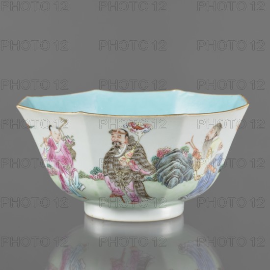 Bowl. Spherical bowl on a ring foot. Porcelain body with turquoise and transparent white glaze. Decoration painted with enamel paints and iron red depicting the Eight Immortals. Colored porcelain, Qing dynasty, Jiaqing period 1796–1820, 18th/19th century. China. Height 8.1 cm; diameter 17.6 cm; weight 0.4 kg., A porcelain bowl with a scalloped rim and a pale blue interior, the exterior decorated with painted figures and landscape elements; visible colors include white, pale blue, pink, green, brown, gray, black, and gold; a group of three human figures in traditional dress is depicted around the bowl, one wearing pink, another in patterned brown and pink garments holding a floral staff, and a third in pale yellow and blue robes with a long beard; painted rocks, foliage, and flowers in green, gray, and pink surround the figures; the rim of the bowl has a thin gold edge and the piece sits on a short foot with a reflection visible on the surface beneath.