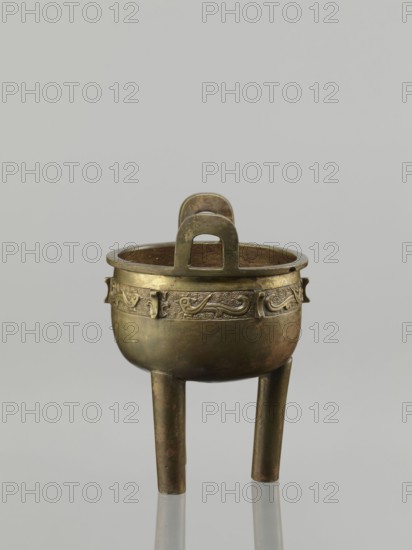 Ding incense burner, leiwen ornament, Ding vessel, Chinese, ceremonial/ritual vessel with bird decorative motif and meander ornament, Qing dynasty 1644–1911, 19th century, China; vessel; height 19.2 cm, diameter 13.6 cm., A metal vessel with a round bowl and a band of raised decorative motifs around its upper exterior, supported by three straight tapering legs, with a pair of upright looped handles rising above the rim; the object shows a metallic brown and aged brass color with areas of darker patina, set against a plain light gray background.