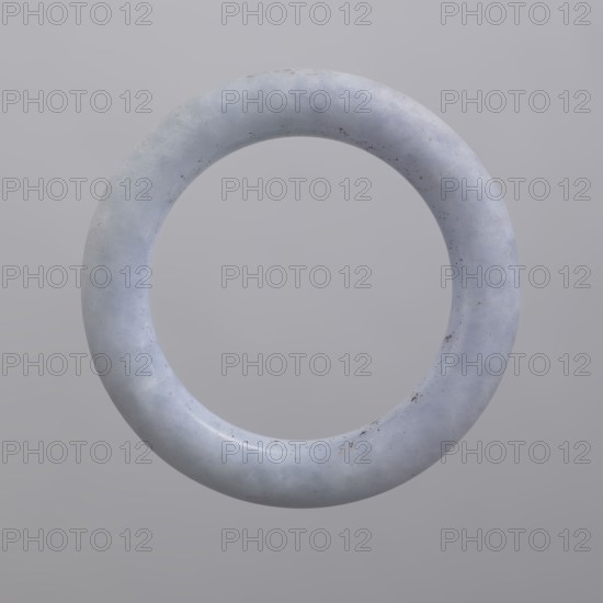 Bracelet, purchased provenance, Chinese, Chinese art, Qing 1644–1911, women's jewelry, poorly worked chalcedony, 19th century, China, jewelry, diameter 7.8 cm, A smooth circular ring suspended against a plain background, with a slightly rough, stone-like surface showing subtle mottled textures and small specks of darker discoloration; the ring is primarily pale gray with hints of bluish and whitish tones, and the background is a uniform light gray.