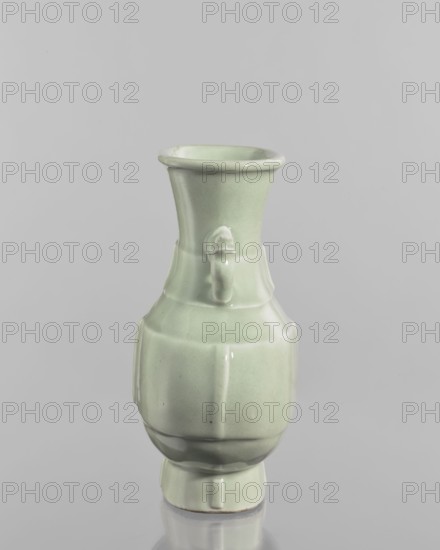 Vase; celadon ceramic decorative vessel, Chinese, Qing dynasty, Qianlong period 1736–1795; decoration with vertical, plastic narrow stripes on foot, body, and neck; height 20.5 cm, width 16.4 cm, depth 6 cm., A pale green glazed ceramic vase with a flared rim, a narrow neck, a rounded body with subtle vertical ridges, and a small stepped base; the surface is smooth and glossy, showing a few darker and lighter green variations and small glaze speckles, with reflected highlights and a faint reflection of the vase on the neutral gray background.