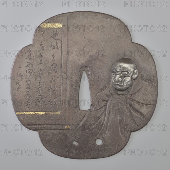 Crossguard tsuba, Kaneie role classification of creator, school craftsman author; gift; Japanese art; Japanese culture; Edo 1603–1868; weapons; bladed weapons; swords; katana; sword crossguards; scrolls; calligraphy; Buddhism; Zen Buddhism; monks; Daruma mythology; Full, four-leaf tsuba. Inlay with shakudo and gold. 18th century Okre Edo 1603–1868, Japan; Fushimi, Yamashiro; tsuba; dia. 11.3 cm, The image shows a fan-shaped metal object with a textured dark brown surface and areas of coppery and gray metallic sheen; a carved human face in relief appears on one side with a grayish-silver tone, furrowed brows, closed mouth, and a bearded chin, draped by sculpted folds that blend into the body of the object; a vertical narrow opening is present near the center with smooth inner edges surrounded by the same dark brown texture; there are a few small round holes near the bottom edge; rectangular insets of bright gold decorate two horizontal areas on the left side and a small strip at the top...
