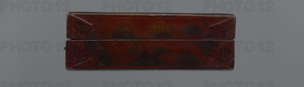 Box; maker, Chinese; Qing dynasty 1644–1911, early 20th century. Container, height 33.7 cm, width 19.5 cm, depth 6.7 cm. Material/decoration: Chinese art featuring landscape motifs with staffage, boats, figural scenes, scholars/sages, defensive walls architectural, and swastikas., A rectangular, closed wooden box with a hinged lid sits centered against a neutral gray background; the box is predominantly deep red with areas of darker red and brown patina, and it has black decorative motifs along the corners and edges as well as darker, nearly black floral or cloud-like shapes on the top surfaces, with small worn spots revealing lighter wood tones and a few scuffed edges.
