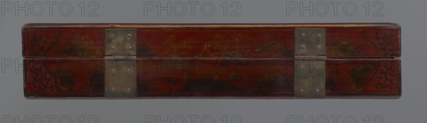 Box, gift; Chinese art, Qing 1644–1911 style, early 20th century, China. Lacquer container with figural scenes including scholars/sages, staffage, boats, defensive walls, landscape motifs, and swastikas. Height 33.7 cm, width 19.5 cm, depth 6.7 cm., A long rectangular wooden box with a hinged lid, shown closed and viewed from the front, finished in a deep red with darker red and black decorative motifs and painted landscape elements, a few areas of brown and golden paint creating mountain and cloud shapes, and two rectangular metal hinge plates with a dull grayish-green patina fastened with round rivets.