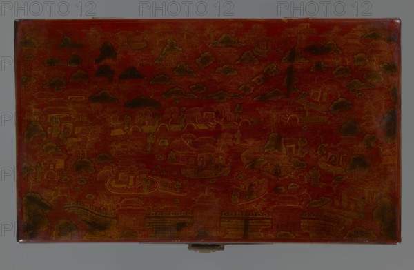 Box, Chinese art, Chinese culture, Qing 1644–1911 style, early 20th century, China. Container with landscape motifs including staffage, boats, figural scenes, scholars/sages, defensive walls architectural, and swastikas. Materials not specified. Dimensions: height 33.7 cm; width 19.5 cm; depth 6.7 cm., A rectangular lacquered panel with an overall red background showing a detailed scene in darker brown and gold tones; the surface is decorated with a landscape of stylized clouds and rounded hills, bridges and archways, small pavilion-like structures, and boats on water, with several human figures standing or seated throughout; the edges show slight wear with darker brown spots, and there is a small metal clasp centered along the bottom edge.