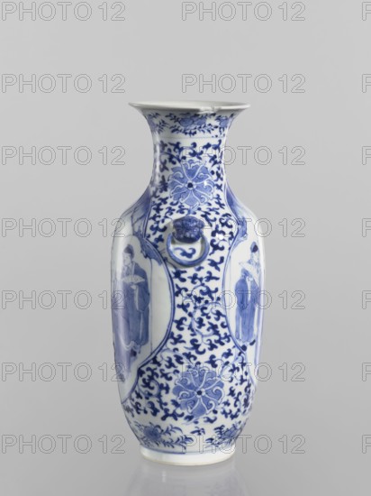 Vase, Chinese, Qing dynasty Kangxi period, 1662–1722. Blue-and-white porcelain ovoid vase with a flaring cup-shaped mouth. Shoulders with two applied mascarons with wheel motifs. Underglaze cobalt-painted decoration: figural scenes in two quatrefoil reserves; background plant ornament with small leaves and large floral rosettes, lotus tendril ornament, fans, and lotuses. Signed. China. Vessel. Height 25.5 cm; diameter 11.1 cm., A white ceramic vase decorated with blue painted designs, showing a flared rim, a narrow neck, and a bulbous body; the surface features floral and scrolling patterns in blue, a few oval panels with painted human figures, and a small sculpted ring handle attached to a stylized face motif, with visible blue accents and white background.