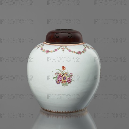Spherical vessel with a lid, flowers, Chinese art, ceramics, Chinese culture, colored porcelain, floral decorations, floral bouquets, happiness symbol. The lid conceals the short neck of the vessel. Around the neck are floral festoons, with a fine ornament at the base. European-style painted decoration. Grayish glaze. Wooden lid with an openwork Fu happiness symbol. 18th century, China, vessel, height 25 cm, A rounded ceramic jar with a smooth white surface and a dark brown wooden lid sits against a gray background, decorated with a garland of small pink and green floral motifs near the top, a central bouquet of multicolored flowers in shades of pink, purple, yellow, orange, and green leaves on the front, and a delicate border of reddish-brown detailing near the base; the jar and its lid are reflected faintly on the surface below.