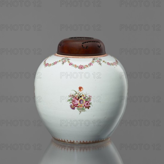 Spherical vessel with a lid, flowers, Chinese art, ceramics, Chinese culture, colored porcelain, floral decorations, floral bouquets, happiness symbol. The lid conceals the short neck of the vessel. Around the neck are floral festoons, with a fine ornament at the base. European-style painted decoration. Grayish glaze. Wooden lid with an openwork Fu happiness symbol. 18th century, China, vessel, height 25 cm, A rounded ceramic jar with a smooth white surface and a wooden lid sits against a gray background; the jar features a small floral bouquet painted on its front in pink, red, yellow, purple, and green tones, a garland of small pink and green flowers near the top edge, and a decorative band in warm brown along the base, while the wooden lid is dark brown with carved ventilation openings.