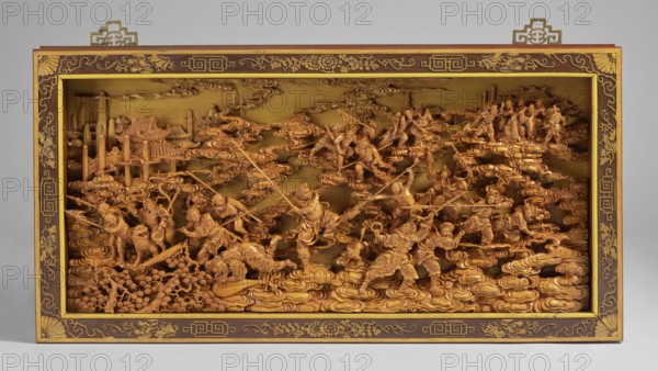 The Monkey King's Fight - panel, unknown sculptor. Chinese art; Chinese culture; Qing 1644–1911. Multi-figure composition depicting a figure from Chinese mythology—literary figures, mythological scenes, fights, battles, weapons, monkeys. Rectangular wooden panel, framed in a gilded wooden frame, behind glass. 1st half of the 20th century, China. Sculpture. Height 45.5 cm; width 90.3 cm; depth 7.5 cm., A carved wooden scene framed in a rectangular wooden frame with decorative corners and edges, showing a group of carved figures arranged among swirling carved cloud forms and architectural elements; the carving and frame are primarily shades of brown and gold, with the wood showing warm tan and amber tones and the frame accents in darker brown and gold; the composition includes carved humanlike figures in dynamic poses, some holding long polelike objects, others standing or kneeling, along with carved animals and carved buildings in the background, all set against layered carved cloud sha...