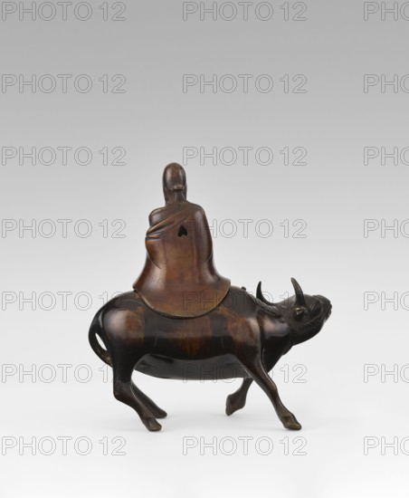 Shoulao on a buffalo - incense burner, creator unknown, Chinese, 19th century Qing, 1644–1911, sculpture/figurine, incense burner depicting Shouxing Shoulao on a buffalo, materials not specified, dimensions: height 20.7 cm, width 20.7 cm; subject: men, buffaloes; cultural context: Taoism., A small sculptural object shows a seated figure with a smooth, rounded head and draped garment riding on the back of an animal that resembles a horned bovine; the figure and animal are rendered in a polished brown material with darker brown and black highlights, exhibiting a glossy surface and subtle variations in tone; the figure's garment has soft folds and a curved shoulder line, and the animal displays a rounded body, four legs in walking positions, a short tail with an opening, a head with two upward-pointing horns and a slightly open mouth, and a gently arched back where the rider sits; the background is a smooth gradient from light gray at the bottom to a paler gray at the top.