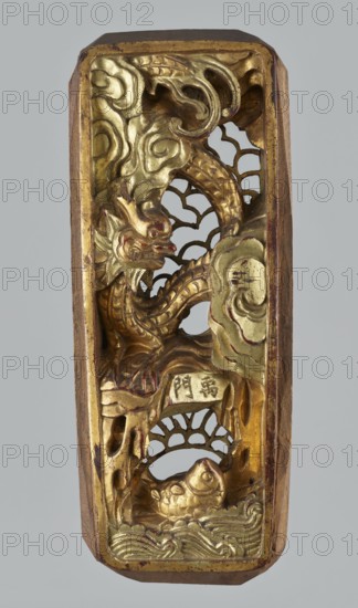 Gate of Emperor Yu Dragon Gate - decorative panel, Chinese, fish, dragons, waves, fantasy animals and beasts; elongated rectangular carved openwork ornament; Qing dynasty 1644–1911, 19th century; sculpture; height 3.7 cm, width 27.4 cm, depth 10.9 cm., A vertical carved panel showing a sculpted mythical creature with a sinuous body and scaled tail amid stylized cloud forms and wave motifs, all rendered in metallic gold with areas of reddish-brown wear and bare wood visible along the outer edges; a group of open lattice-like cutouts appears behind the creature, and a rounded fish-like form rests near the lower section among carved waves, with background tones of gray around the object.
