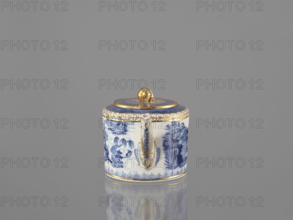 Teapot with a lid, Chinese, Qing dynasty 19th century, 1644–1912, blue-and-white porcelain teapot, ceramics, landscape motifs; part of a 22-piece tea and coffee service includes teapot, 6 cups, 6 bowls, 6 saucers, a bowl, a lid, and a plate. Vessel; height 11 cm, width 21.9 cm, diameter 11.6 cm., A small cylindrical porcelain container with a lid sits on a reflective surface against a plain gray background; the container is primarily white with intricate blue painted scenes around its sides and a blue band on the lid, and it is accented with gold trim and a gold knob on top, with a decorative gold-accented handle on the front and a subtle reflection of the object visible on the surface.