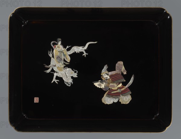 Tray, Meiji period 1868–1912, Japan. Lacquer tray black roiro lacquer decorated with inlaid mother-of-pearl and bone; bottom finished in nashiji lacquer. Iconography includes samurai, dragons, fans, swords, and Kannon. 19th–20th century. Vessel; height 30.1 cm, width 39.4 cm., A rectangular black lacquer tray with a glossy finish and a thin gold rim shows a decorative scene of two inlaid figures near the center against the black background: a graceful figure wearing flowing garments in pale yellow, cream, gray, and muted green riding on or accompanied by a silvery white dragon, and a warrior figure dressed in layered armor with red, black, gold, cream, and muted purple tones holding a folded object and a feathered element; the tray corners are gently scalloped and the overall palette includes black, gold, silver, cream, red, muted green, gray, and purple.